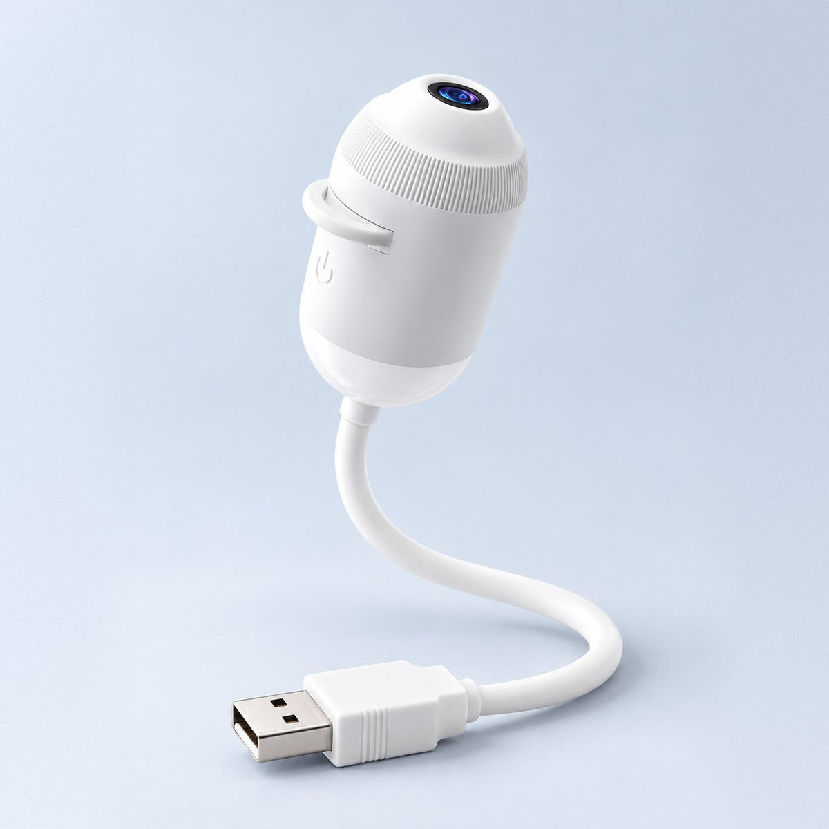 Le projecteur Moonyx en studio : tête blanche, objectif bleu, câble souple et prise USB